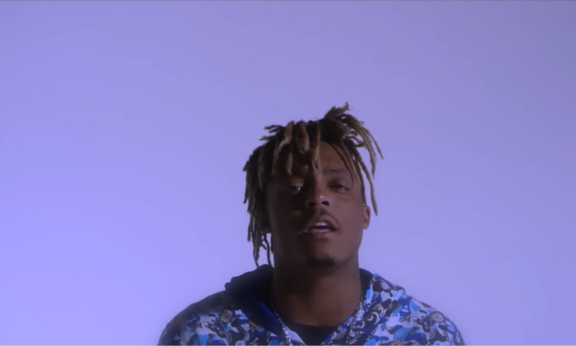 Juice WRLD on a purple background